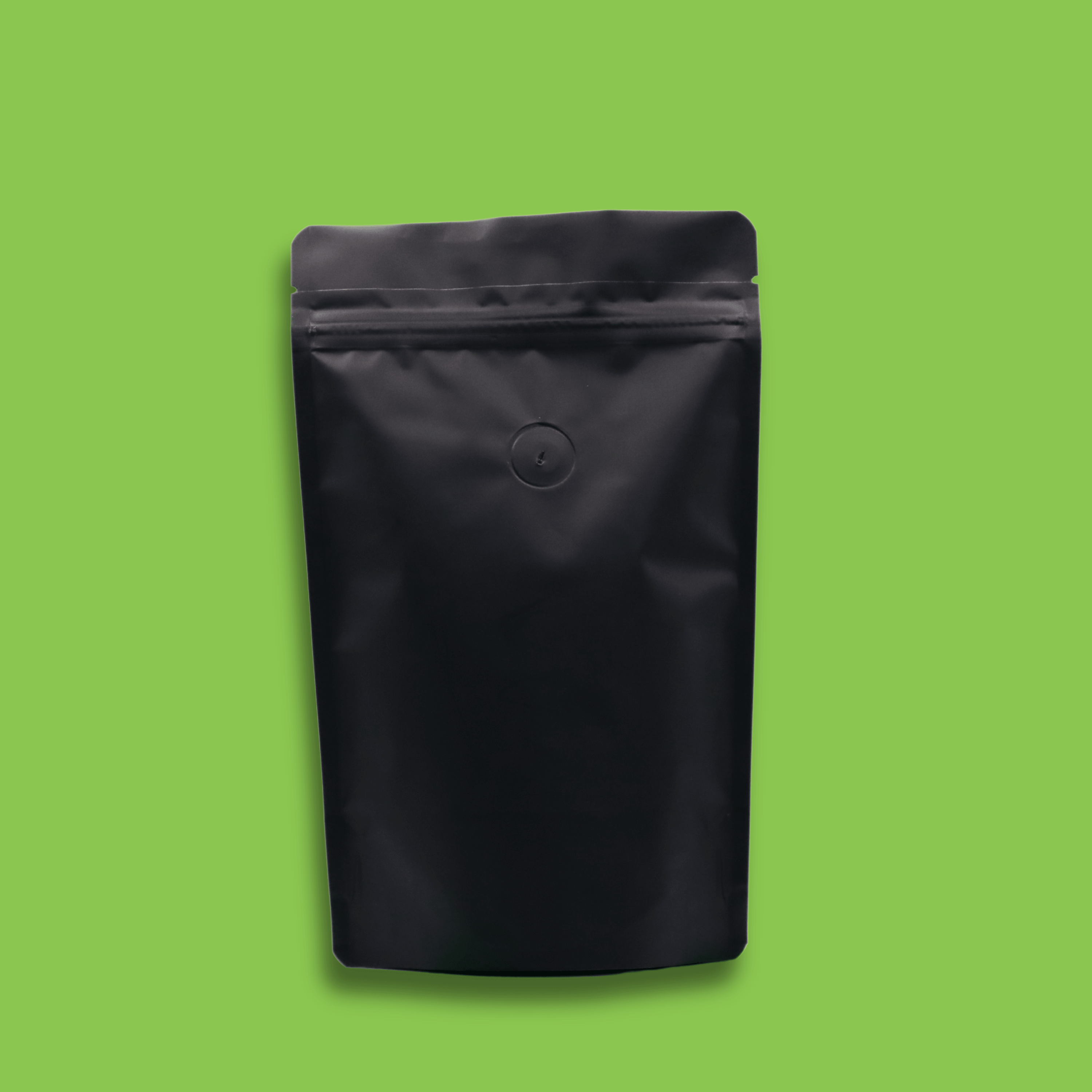 The back of a 125g bag of dark roast, whole bean, Shadow Panther specialty coffee in front of a green background.