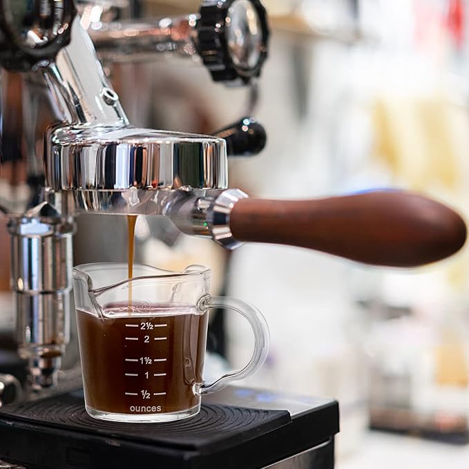 Double spouted espresso cup being brewed into