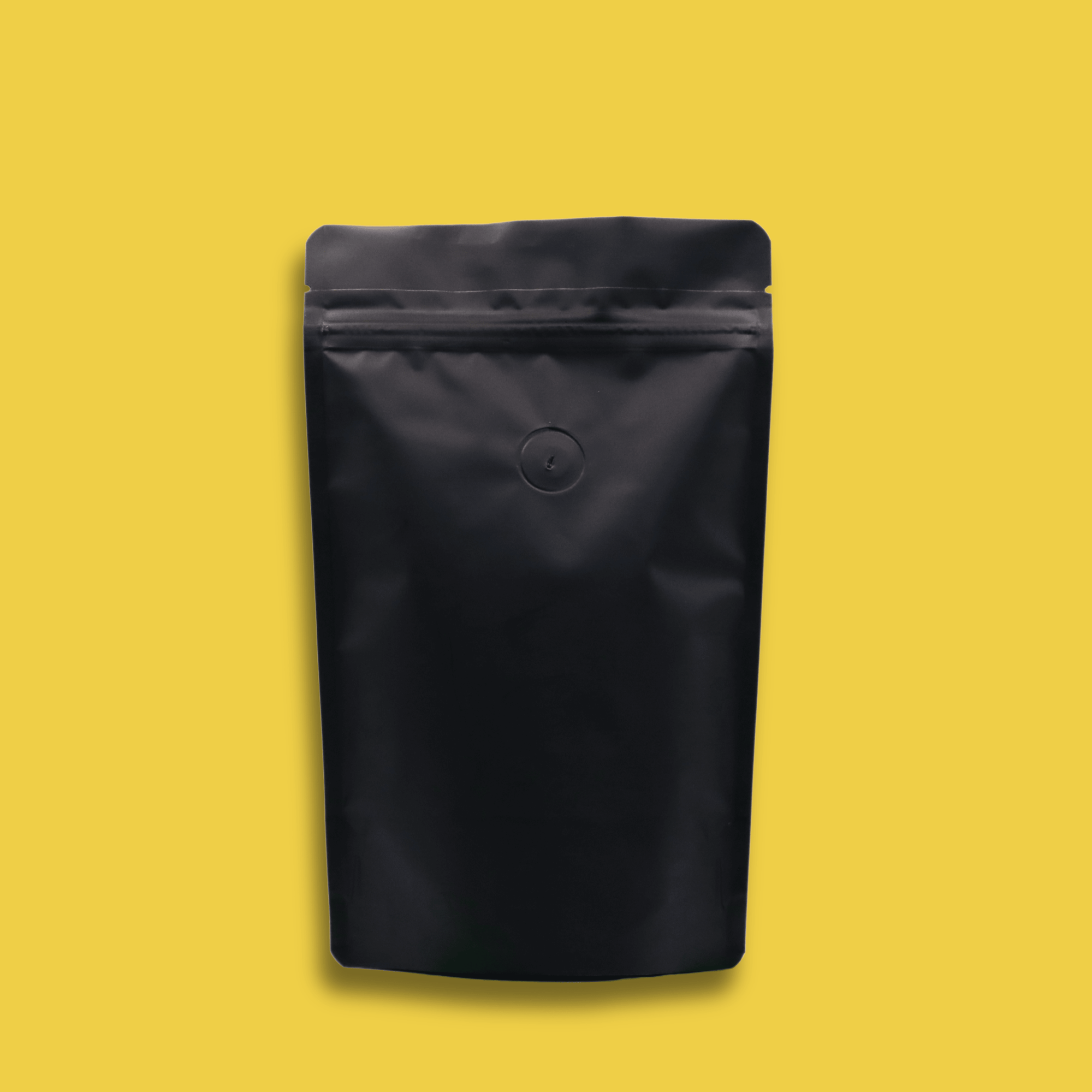 The back of a 125g bag of light roast, ground, Space Goat specialty coffee with a yellow background.